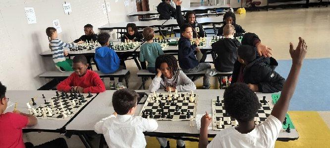  Students playing Chess at school